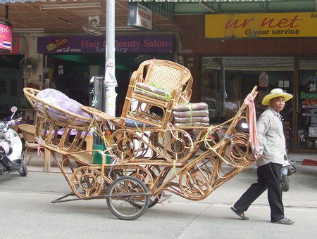 Thongpoon Naktae walks all over the city, trying to sell his rattan furniture so he can send his son to school.